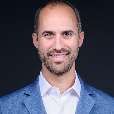 headshot of Zach Rachins